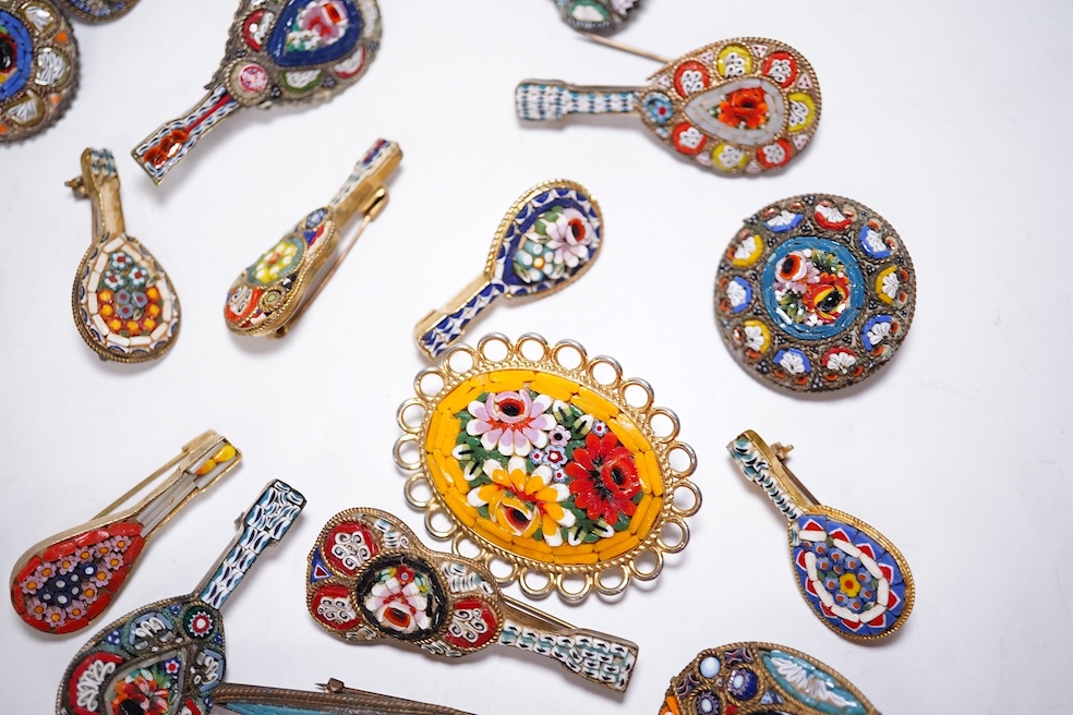 A collection of thirty-one micro-mosaic brooches, including fourteen mixed guitar and banjo shaped brooches, six large oval brooches and seven smaller brooches, three long brooches and a star shaped brooch. Condition - g